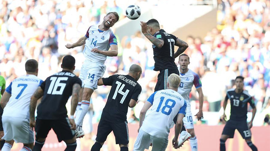 Kari Arnason (L top) of Iceland competes for a head ball with Nicolas Otamendi (R top) of Argentina during a group D match between Argentina and Iceland at the 2018 FIFA World Cup in Moscow, Russia, June 16, 2018. (Xinhua/Xu Zijian)
