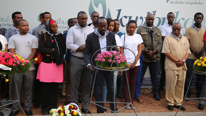 Clement Uwajeneza, Chief Executive Officer of Rwanda Online and members of ICT Chamber lay wreaths at Kigali Genocide Memorial Centre yesterday. Frederic Byumvuhore.