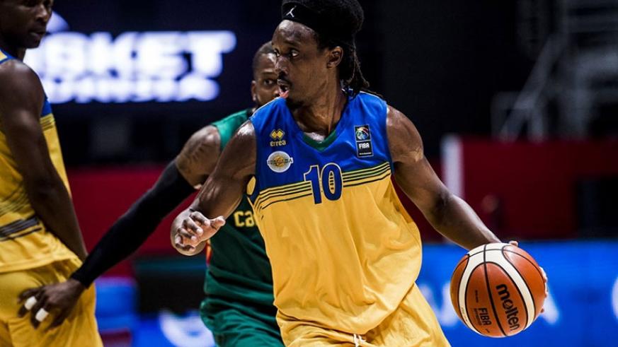 Hamza Ruhezamihigo (R) against Mali in the qualifiers of the 2019 FIBA World Championship in Bamako in February 2018. File.