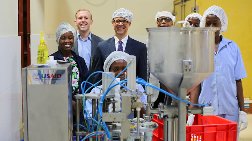 Ambassador Vrooman (3rd left, wearing glasses)during his visit to Masaka Creamery Ltd. Courtesy.