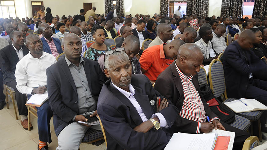 Umurenge Saccos managers from across the country in a meeting with RCA and Minicom officials in Kigali. Diane Mushimiyimana.