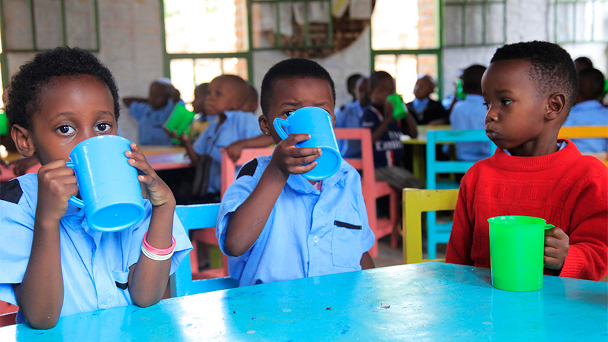 Children drink porridge at Mageragere Early Childhood Development Centre Nyarugenge District. Malnutrition has reduced from 50% to 38%. Sam Ngendahimana.