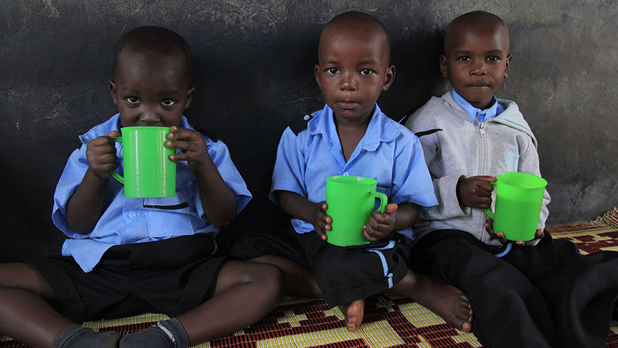 Children eat porridge at  Mageragere Early Childhood Development Center in Nyarugenge District. Sam Ngendahimana.