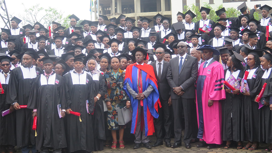 Different officials pose for a group photo with ILPD graduates-Eddie Nsabimana