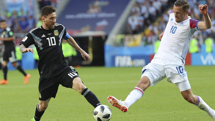 Lionel Messi (L) of Argentina vies with Gylfi Sigurdsson of Iceland during a group D match between Argentina and Iceland at the 2018 FIFA World Cup in Moscow, Russia, June 16, 2018. The match ended in a 1-1 draw. (Xinhua/Bai Xueqi)