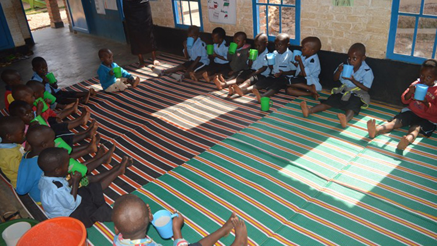 Children served with nutritious porridge at the ECD.