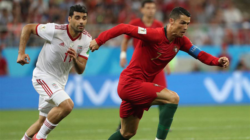 Cristiano Ronaldo (R) of Portugal competes during the 2018 FIFA World Cup Group B match between Iran and Portugal in Saransk, Russia, June 25, 2018. (Xinhua/Ye Pingfan)