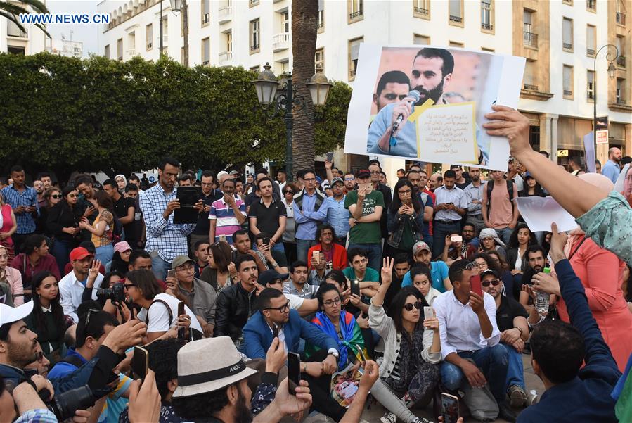 People gather in front of the Moroccan Parliament demanding the release of Nasser Zefzafi and other leaders of the protest movement in Rabat, Morocco, on June 27, 2018. Late on Tuesday, Nasser Zefzafi, figurehead of the protest movement, along with three other leaders, was handed 20 years' imprisonment. (Xinhua/Aissa)