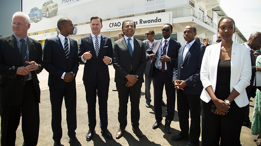 Volkswagen officials and local officials pose for groupe photo after the inauguration of Volkswagen operations in Rwanda yesterday (Sam Ngendahimana)
