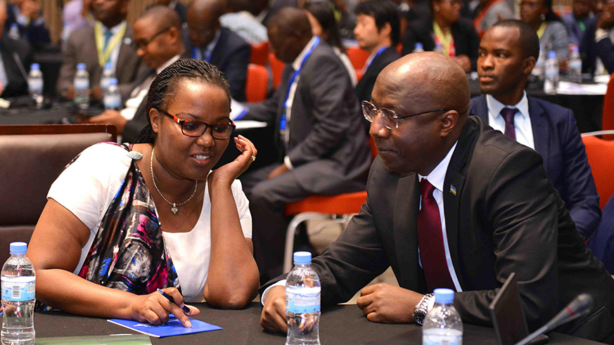 Prime Minister Edouard Ngirente consults with agriculture minister Gerardine Mukeshimana during the launch of the fourth Agriculture Transformation Strategy yesterday. The ambitious strategy is to be financed by public funding, development partners like the European Union and the private sector. / Courtesy