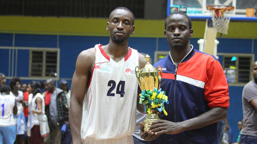 REG guard Patrick Habiyaremye (right) with his captain Ali Kazingufu (left) after winning this yearâ€™s Heroes Day tournament at Amahoro Indoor Stadium in February. Courtsey.