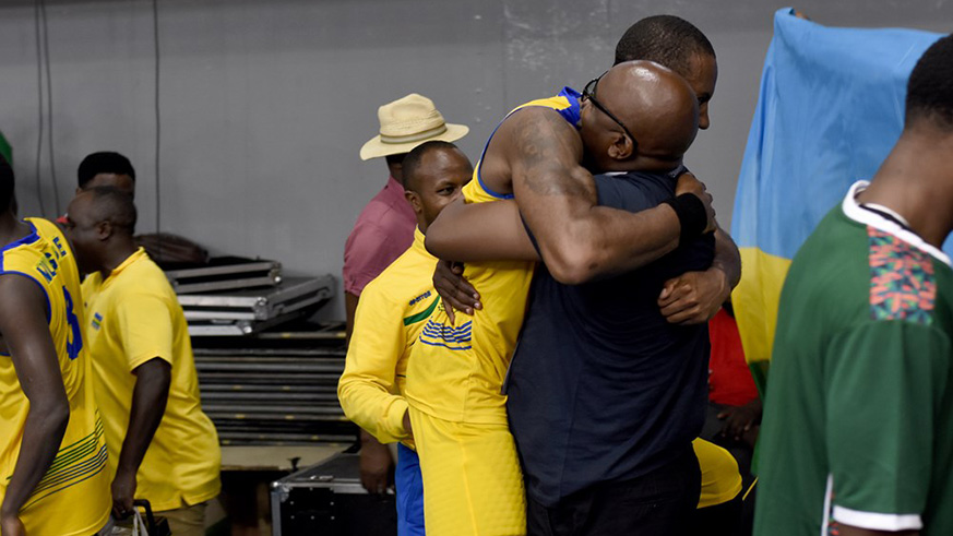 Rwanda Basketball Federation's President, Desire Mugwiza, and forward Darrius Garret hug as they celebrated the long-awaited win to halt Uganda's supremacy over Rwanda in the last five years. / Courtesy