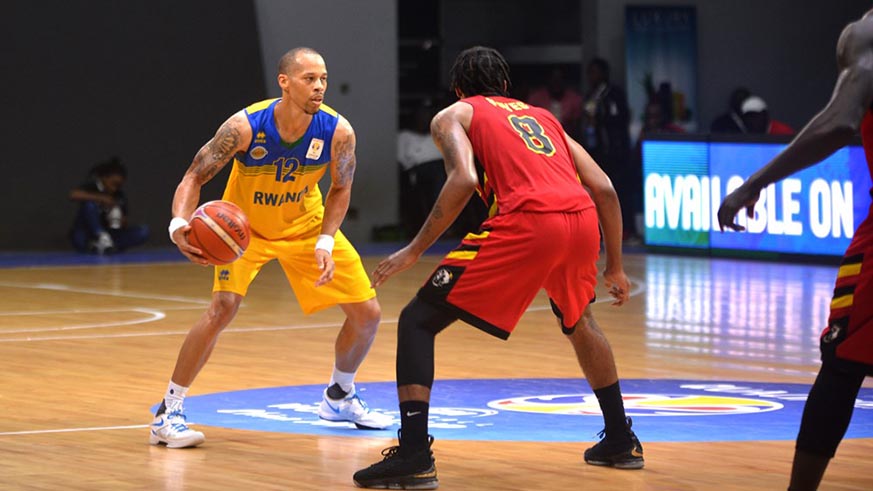 Point-guard Kenneth Gasana (with the ball) dropped a game high 20 points to inspire Rwanda to a first win against Uganda in five years. Courtesy