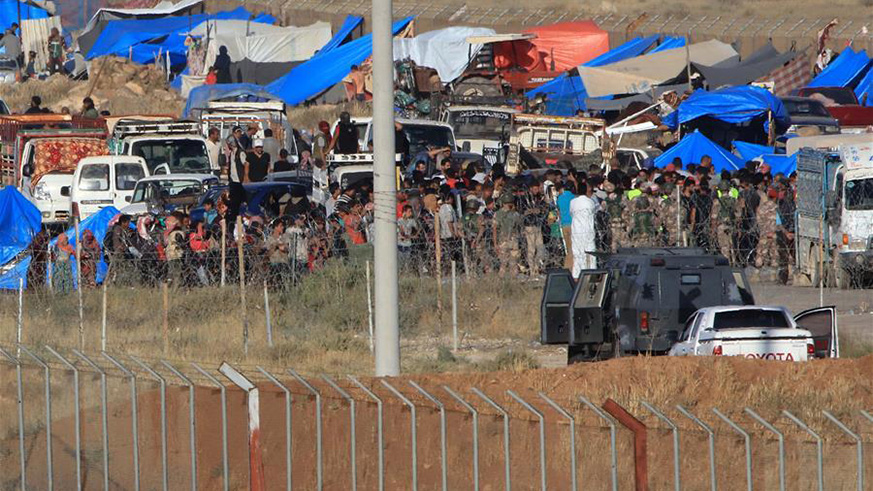 Syrian refugees are seen inside the Syrian territory near Jordan's Jaber border crossing with Syria, on July 1, 2018. Jordan's State Minister for Media Affair Jumana Ghneimat on Saturday announced that the Jordan Armed Forces began dispatching humanitarian aid to Syrian territory. Thousands of Syrian refugees have started leaving their homes in Syria's Daraa and headed to the borders with Jordan. (Xinhua/Mohammad Abu Ghosh)