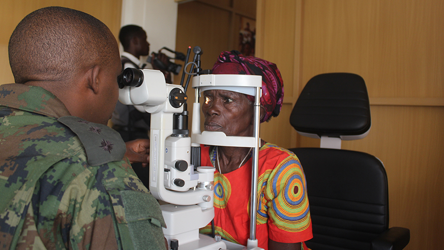 An RDF medical personnel checks one of the patients at Ruhango hospital during the outreach activity.  About 40,000 people have received medical care as part of the Citizen Outreach Programme. Photos by Jean du2019Amour Mbonyinshuti.