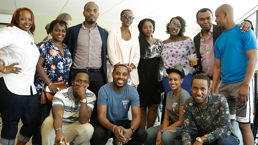 Mike Mwenedata (squatting, second left) and his team at the grand opening of the Rwanda Bean Company. File.
