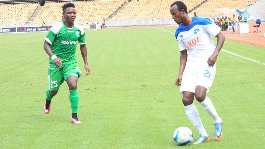 Rayon Sports midfielder Olivier Seif Niyonzima (with the ball) preps to beat off Gor Mahia's defender George Odhiambo in second-half during the two sides' 2-all stalemate on Sunday in Dar es Salaam. (Courtesy)