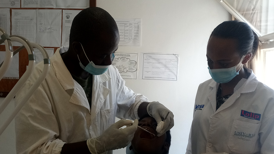 RDF officer tests oral disease for one of patients who turned up to Ruhango hospital for free treatment. Jean d'Amour Mbonyinshuti