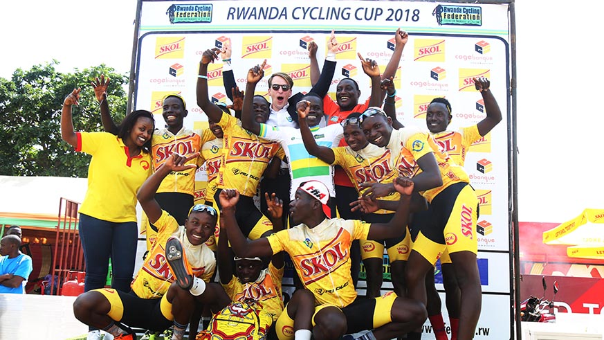 Fly Cycling Club riders celebrate with head coach Jordan Lewis Mathes after Jean Eric Habimana (in white jersey) won juniors national championship title. Sam Ngendahimana.