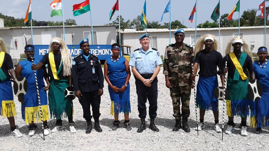 Police Commissioner, Brig Gen Georges-Pierre Monchotte with Rwandan peacekeepers in Haiti after their decoration on Tuesday. Courtesy