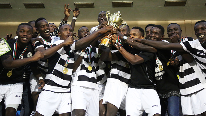 Intare FC players lift up the trophy to celebrate the Second Division League title on Wednesday. Sam Ngendahimana.