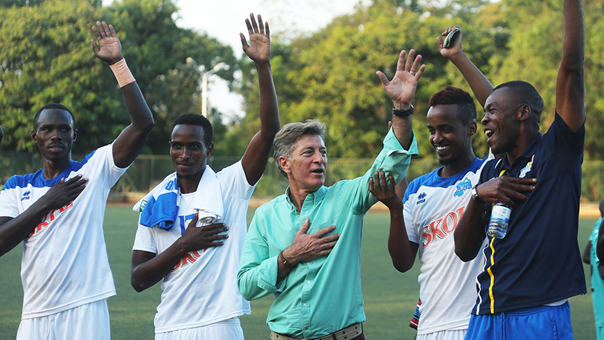 Rayon Sportsu2019 Brazilian coach Roberto Oliveira (middle) join players to sing the clubu2019s trademark anthem after routing Sunrise FC 4-0 in a past league match at Kicukiro Stadium. Sam Ngendahimana.