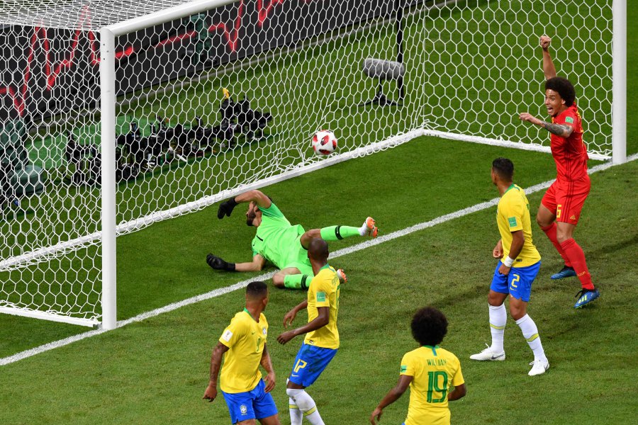 Brazil's midfielder Fernandinho (2nd left) looks at the ball after scoring an own-goal during the Russia 2018 World Cup quarter-final football match between Brazil and Belgium at the Kazan Arena in Kazan. Net. 