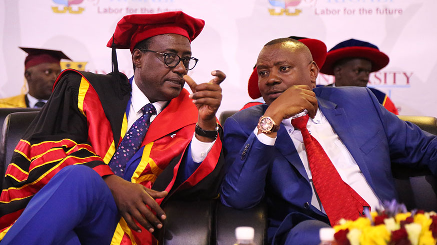 Prof  Manasseh Nshuti , the chair board of promoters chats with  Minister of State in Charge of Primary & Secondary Education Isaac Munyakazi during the event (Sam Ngendahimana)