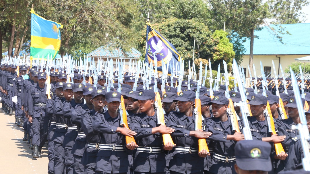 Minister Busingye inspects a guard of honour mounted by the new officers yesterday. Courtesy. 