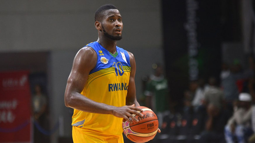 Power forward Olivier Shyaka played a crucial role on the course to Rwandau2019s battle to the second round qualifiers. He is seen here preparing to take a free-throw against Uganda last Sunday in Lagos, Nigeria. Courtesy.