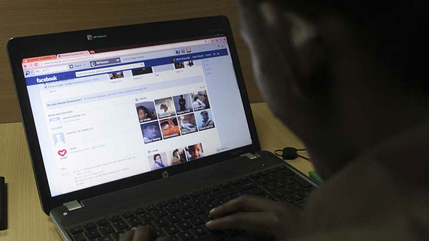 A person browsing on Facebook. The social media giant new feature enables users to set daily limits on time spent on the site. Net photo.