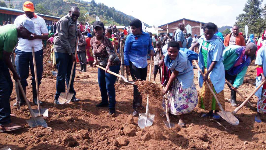 Officials including the Minister of Health, Dr. Diane Gashumba(in black hat) paving the ground where Rubona Health Post is going to be built. Regis Umurengezi