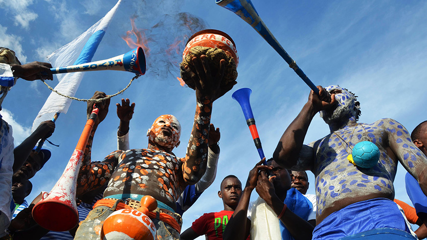 Rayon Sports and Bugesera FC fans raise their vuvuzela to cheer on their players during the league match. / Sam Ngendahimana