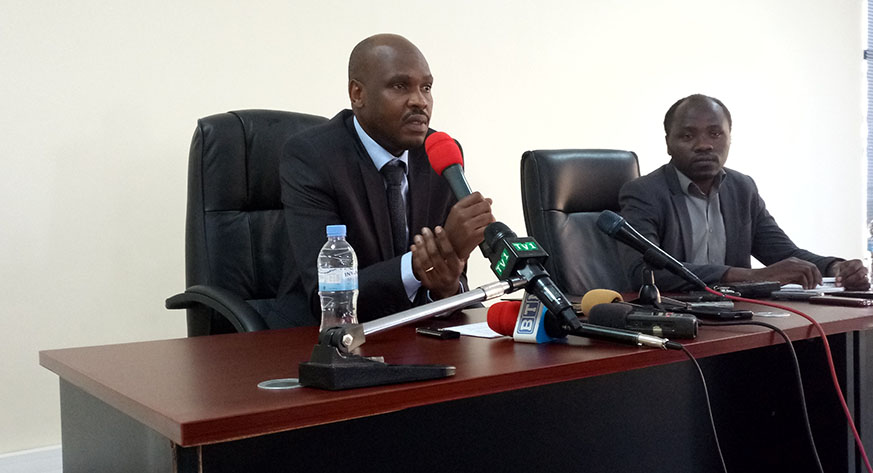 DG for Crime Intelligence at RIB, Peter Karake speaking during a press conference on the fight against counterfeit veterinary products, while RAB's Dr. Rukundo looks on (Ntirenganya)