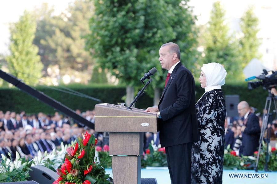 Turkish President Recep Tayyip Erdogan, accompanied by his wife Emine Erdogan, delivers a speech during a ceremony at the Presidential Palace in Ankara, Turkey, on July 9, 2018. Recep Tayyip Erdogan took the oath of office at parliament on Monday, marking the country's switch to a new era with the executive presidential system. (Xinhua/Qin Yanyang)