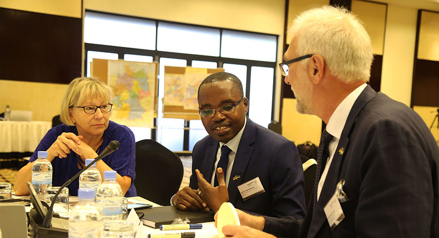 L-R: Nauheim Ulrike, RALGA Secretary General Ladislas Ngendahimana and Dr Karl Heinz share views during the meeting yesterday. Sam Ngendahimana.
