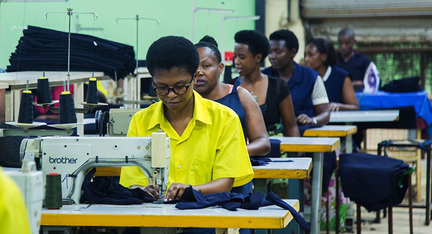 Employees in a production section of a Kigali-based garments manufacturer. Following the passing of the new labour law by Parliament on Monday, a ministerial decree will determine the minimum wage. Nadege Imbabazi.