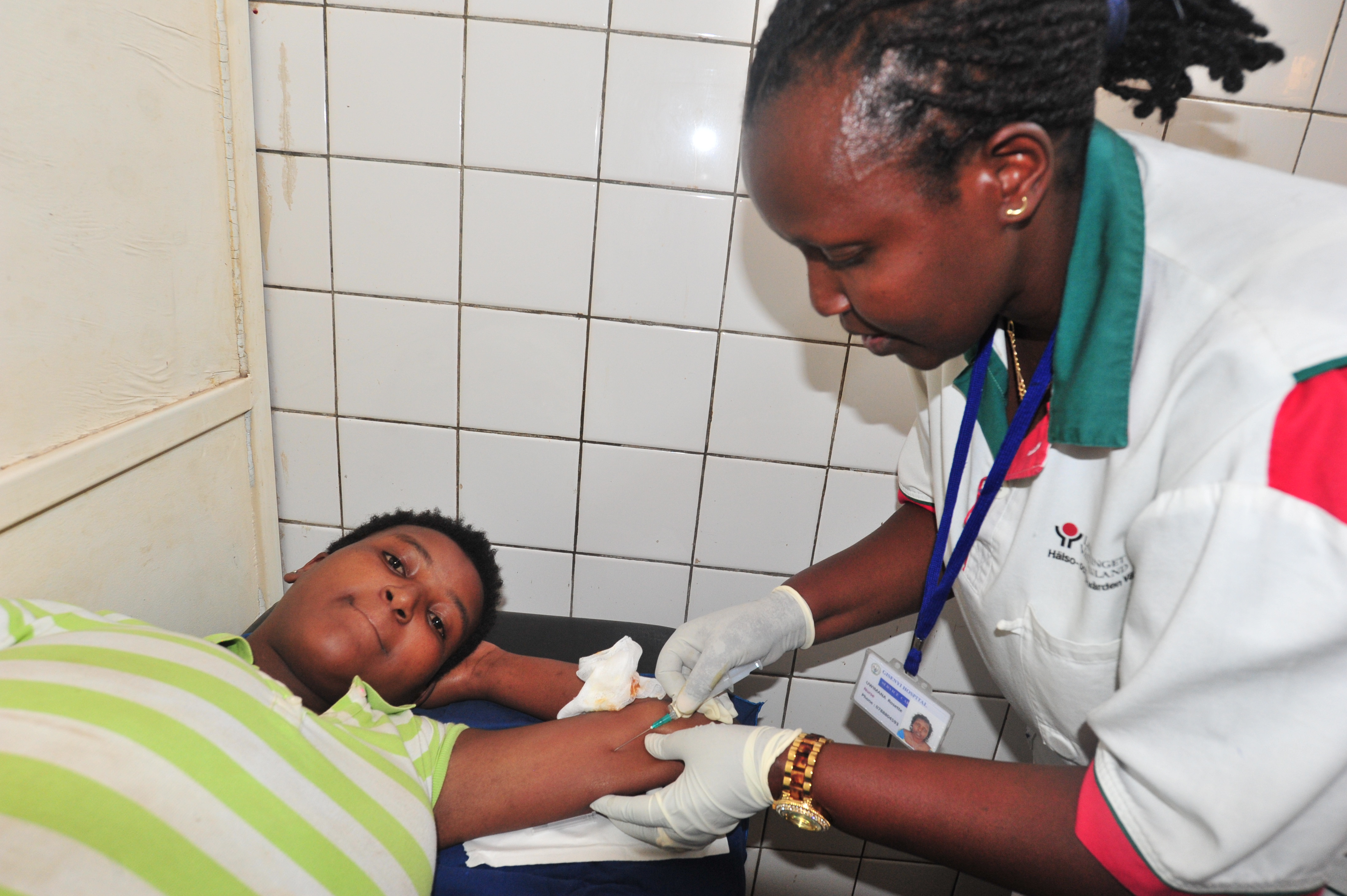 A nurse giving a client a family planning method. / Courtesy