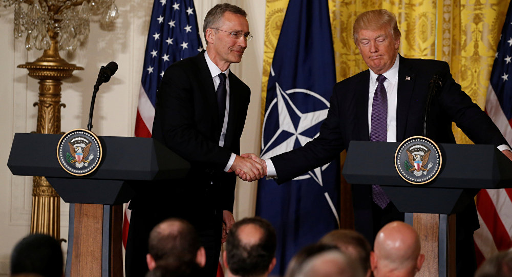 U.S. President Donald Trump (R) and NATO Secretary General Jens Stoltenberg shake hands during a joint news conference in the East Room at the White House in Washington, U.S., April 12, 2017. / Sputnik