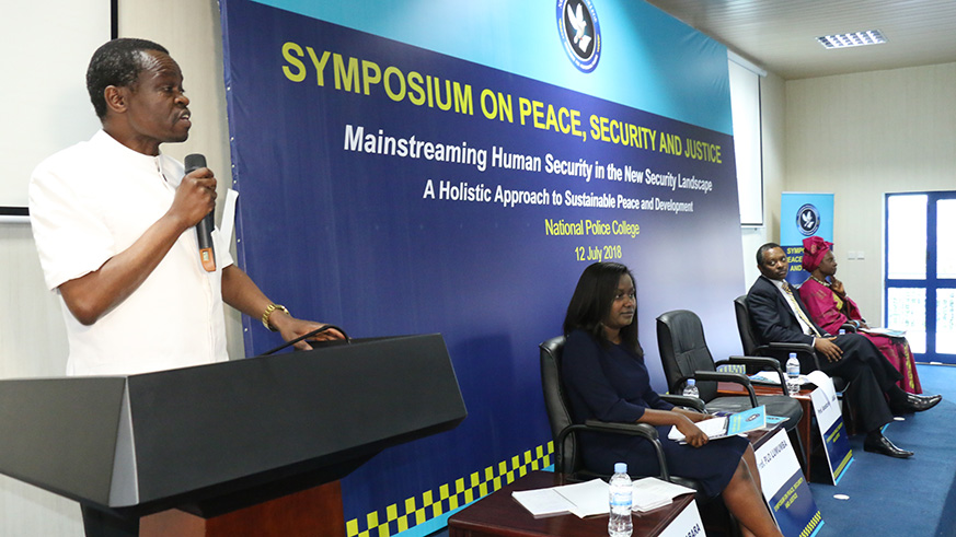 Prof.  Patrick Loch OTIENO Lumumba speaking during the symposium