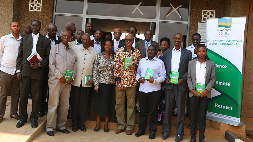 Elderly experts, RNOSC and MINISPOC officials after the official launch of the book about the ancient traditional sports on Friday at Amahoro Stadium. Jejje Muhinde.