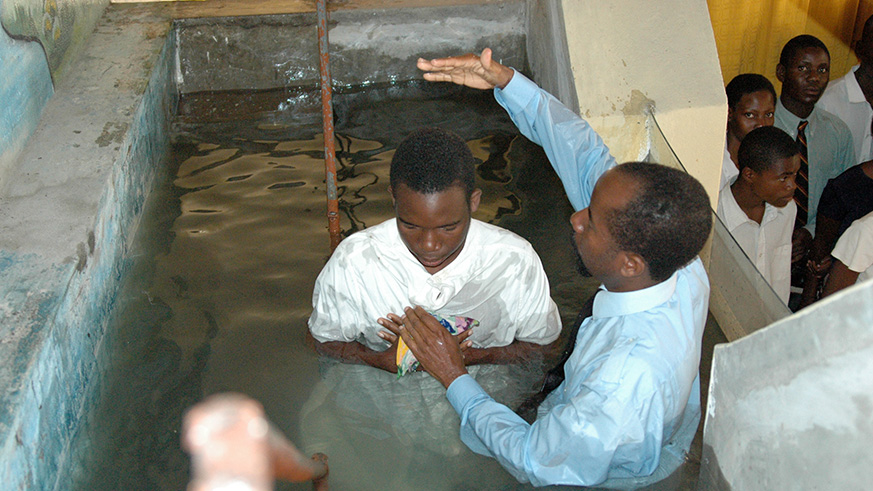 A man being baptised. File.