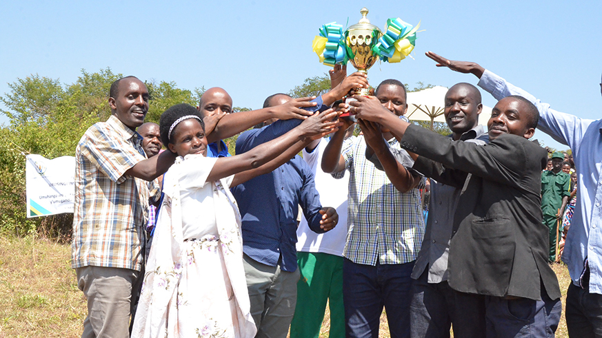 Before the event, the officials and residents officially started the Umuganda Month by transporting stones to build the new schoolâ€™s toilettes.