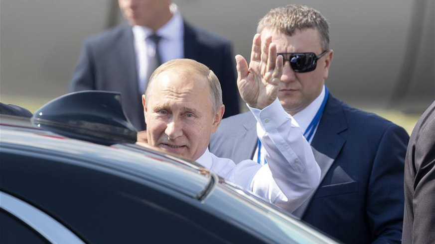 Russian President Vladimir Putin waves to people as he arrives in Helsinki, Finland, on July 16, 2018.