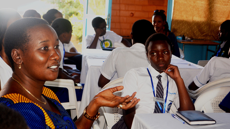 Juliene Uwacu, the minister of Sports and Culture interacts with the students. 
