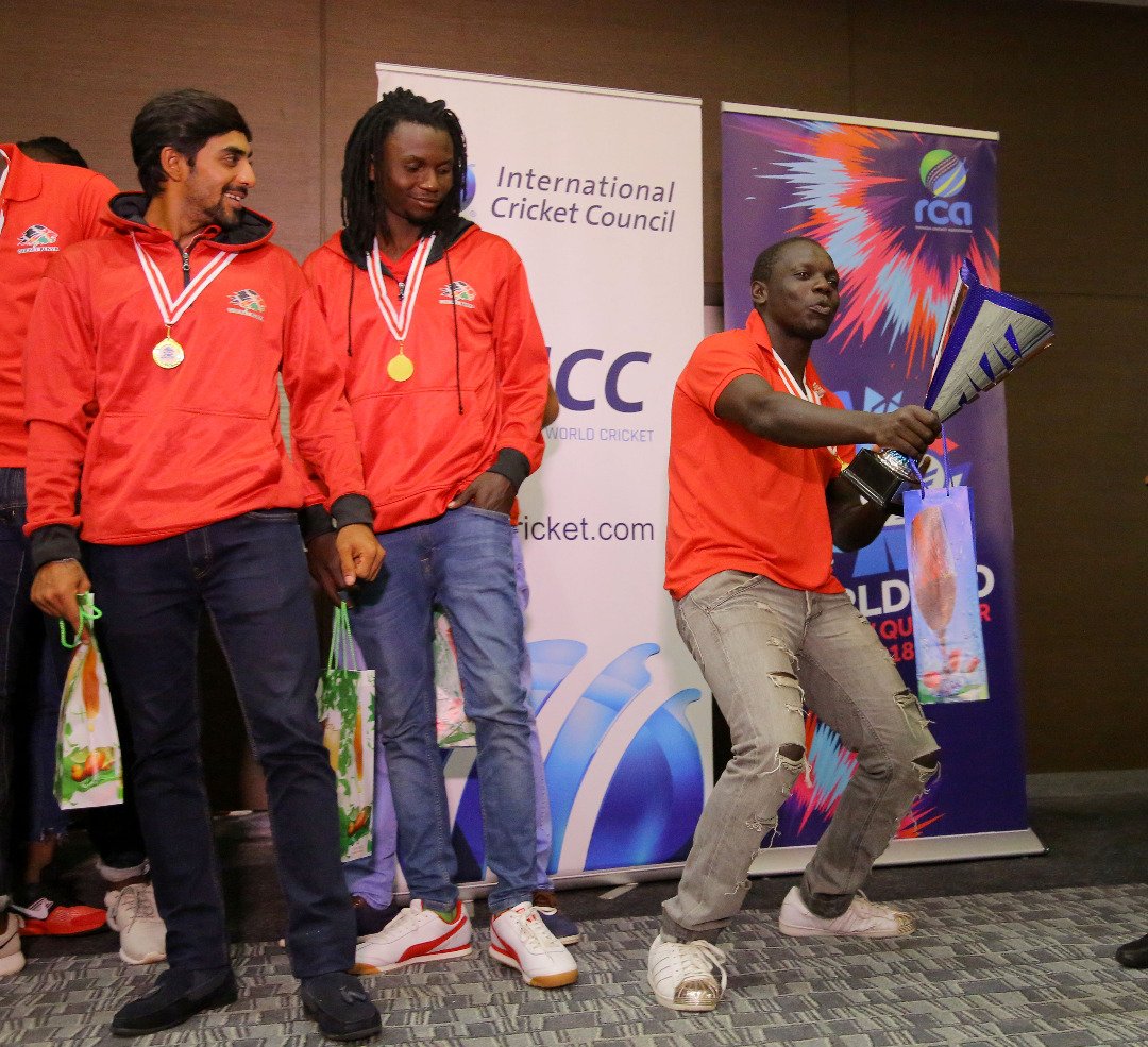 A Kenyan player celebrates after receiving the trophy. 