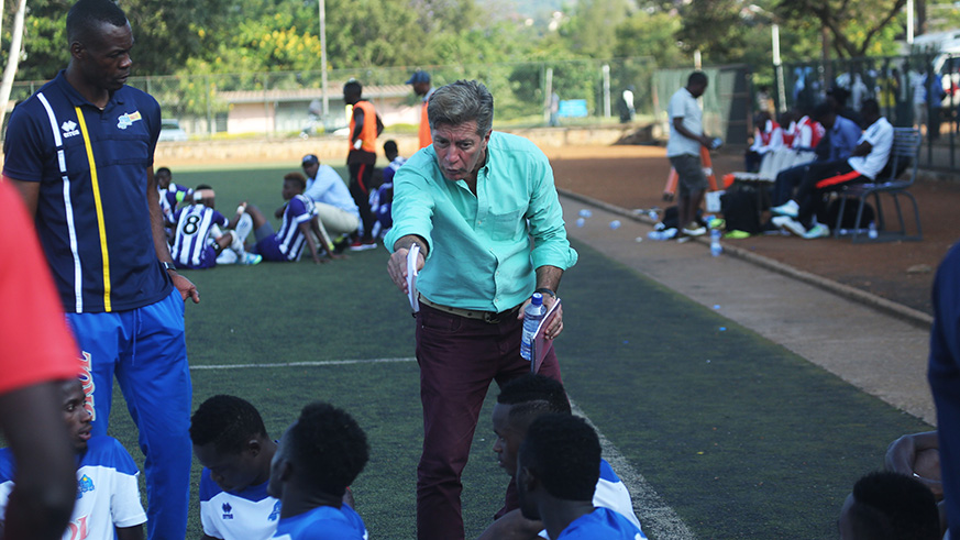 Rayon Sports head coach Roberto Oliveira Goncalves do Carmo gives instructions to his players at half-time during a match against Sunrise FC at Kicukiro. Sam Ngendahimana.