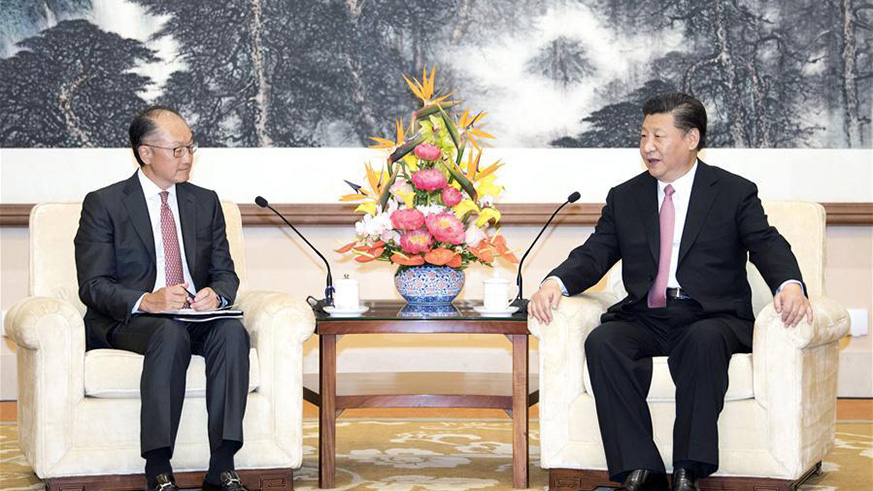 Chinese President Xi Jinping (R) meets with World Bank President Jim Yong Kim in Beijing, capital of China, July 16, 2018. (Xinhua/Li Xueren)