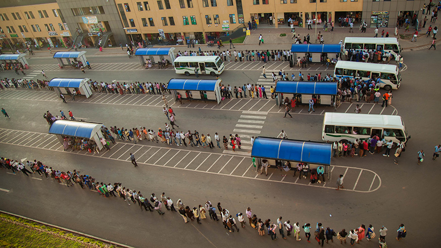Lines of passengers waiting for buses in down town Bus Park. Nadege Imbabazi.