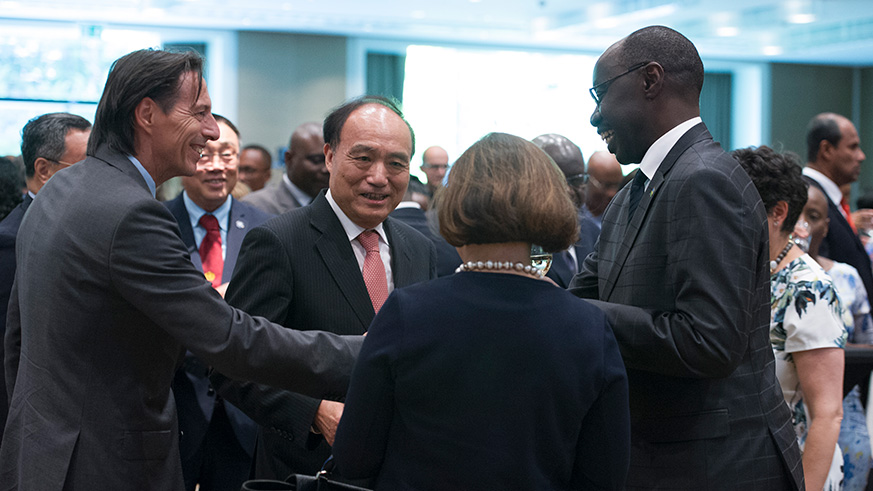 Rwandau2019s ambassador to Geneva, Dr Francois Ngarambe, shares a light moment with guests, including the Secretary-General of ITU Houlin Zhao (centre) during the event. Courtesy.